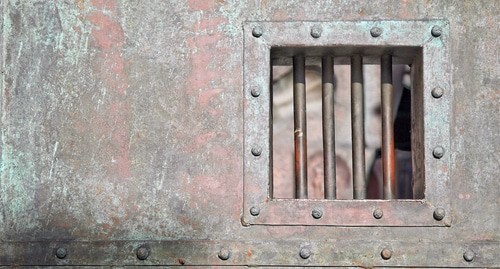 A prison cell door. Photo by ruslan2525 https://www.flickr.com/photos/ruslan2525/4466092738/in/photolist-7NDTLW-R6HQfm-2asYQc7-h6q1ri-6Jt6zY-ZveRmU-9YzFwz-arLw2X-R6HR33-R6HQJY-Zf4Meg-2gtfv5A-dycgxe-as48rh-arLw5X-dhPJJ3-qwdRF3-LhRCfW-7bmekh-52KLcX-YbVfq5-UtPHNH-3nVYtQ-3nVX8S-Yg4JoK-YzZuJr-4zBgFt-25ntFhx-niMRAn-5tXcYH-9evwa8-YAwYqz-YP8Xrn-dVYet5-Ywgeyw-aCESiH-dhPJJ6-YPakQi-BQmTG3-4AUGMV-e6ichS-Gcgb87-YAwbhn-GHHSti-5wfLxC-sPQmWg-9xqQdr-nZZqSb-5wbub8-ywb64