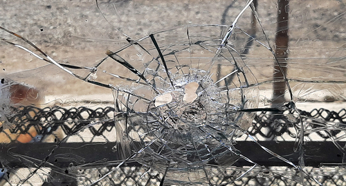 A bullet hole in the window of a home in the village of Krasny Bazar. Photo by Alvard Grigoryan for the "Caucasian Knot"