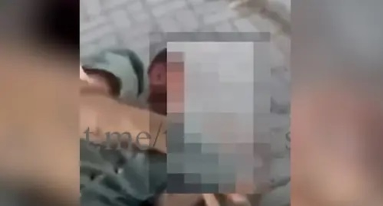 Footage of the beating of Beslan Edilov. Screenshot: https://www.youtube.com/watch?v=gixDyCGY9xY&t=63s