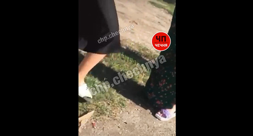 Screenshot of a video with an adult woman beating a teenage girl, Chechnya, July 30, 2022, Telegram-Channe ‘ChP/Grozny’