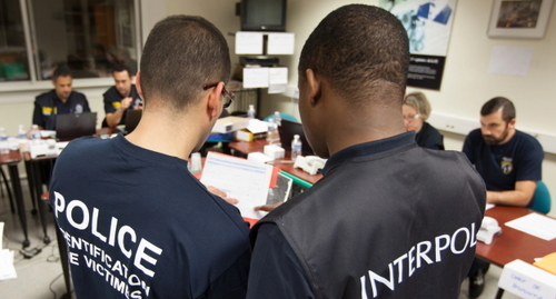 The police and Interpol officers. Photo by the Interpol's press office https://www.interpol.int/News-and-Events