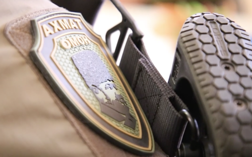 A badge of the "Akhmat-Grozny" OMON unit. Screenshot of the video in the post https://t.me/RKadyrov_95/3622 A badge of the "Akhmat-Grozny" OMON unit. Screenshot of the video in the post https://t.me/RKadyrov_95/3622