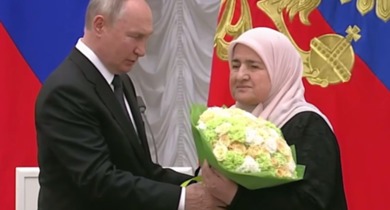 Vladimir Putin and Aimani Kadyrova. Screenshot of the video posted on Ramzan Kadyrov's Telegram channel on August 2, 2023 https://t.me/RKadyrov_95/3794