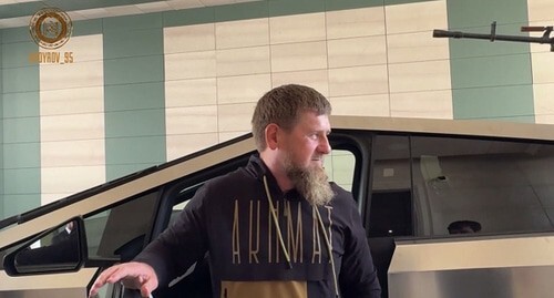 Ramzan Kadyrov at the background of a Tesla Cybertruck, screenshot of a photo posted on Kadyrov's Telegram channel https://t.me/RKadyrov_95