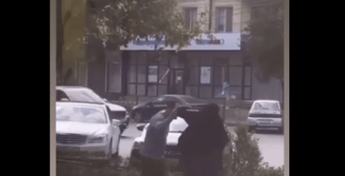 A man tried to remove niqab 
from a Muslim woman in Dagestan. Screenshot of a video posted by the Telegram channel "Chto Tam u Dagestantsev" (What's Going On With Dagestanis) on August 28, 2024 https://t.me/dagestanRD/48650