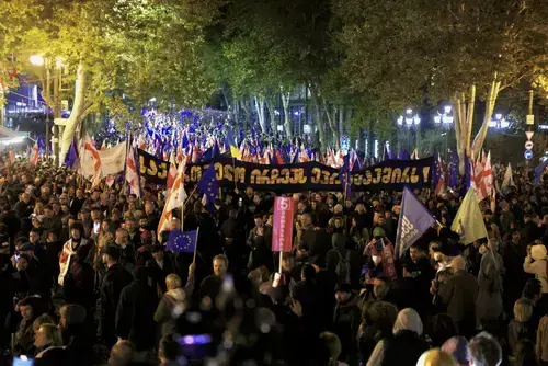 People at a rally holding posters calling for Georgia's European Union integration. Photo: Guram Muradov/Civil.ge People at a rally holding posters calling for Georgia's European Union integration. Photo: Guram Muradov/Civil.ge