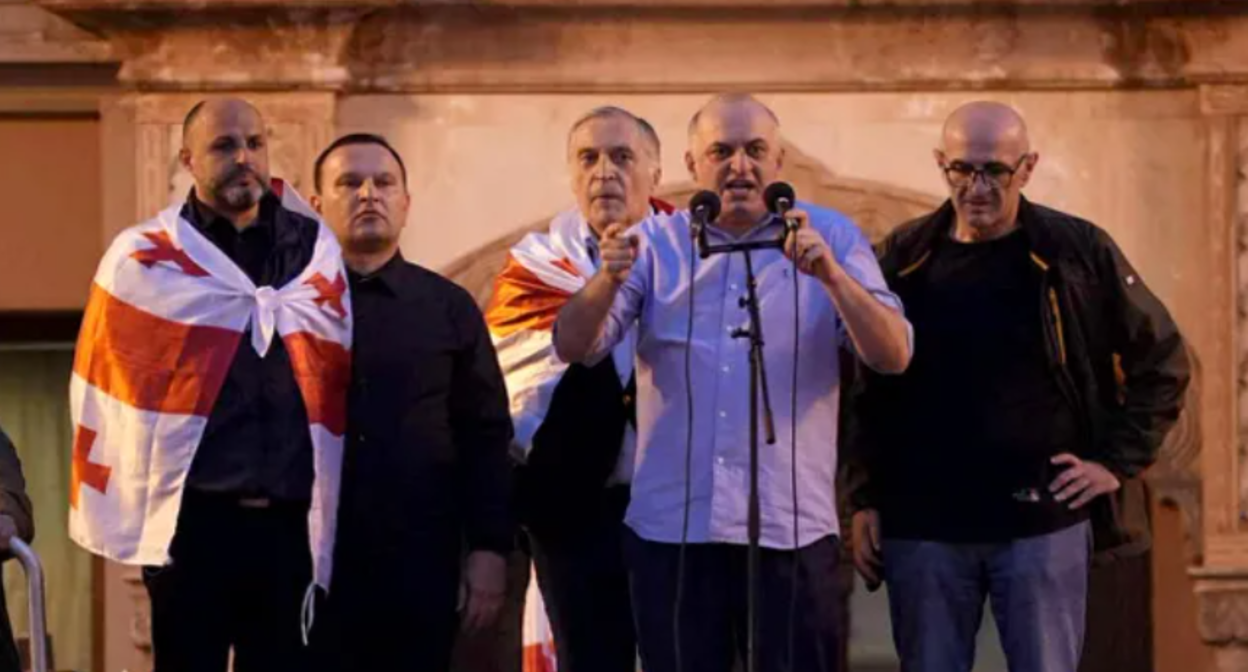 From left to right: Irakli Nadiradze, Paata Manzhgaladze, Paata Burchuladze, Murtaz Zodelava, Lasha Beridze at the rally 04.10.25. Screenshot of photo "Interpressnews" https://www.interpressnews.ge/ru/article/174819-po-delu-4-oktiabria-paata-burchuladze-murtaz-zodelava-iraklii-nadiradze-lasha-beridze-i-paata-ma ndzhgaladze-prigovoreny-k-7-tornike-mchedlishvili-nika-gventsadze-iraklii-chkhvirkiia-k-5-a-iraklii-shaishmelashvili-k-2-godam-lisheniia-svobody. From left to right: Irakli Nadiradze, Paata Manzhgaladze, Paata Burchuladze, Murtaz Zodelava, Lasha Beridze at the rally 04.10.25. Screenshot of photo "Interpressnews" https://www.interpressnews.ge/ru/article/174819-po-delu-4-oktiabria-paata-burchuladze-murtaz-zodelava-iraklii-nadiradze-lasha-beridze-i-paata-ma ndzhgaladze-prigovoreny-k-7-tornike-mchedlishvili-nika-gventsadze-iraklii-chkhvirkiia-k-5-a-iraklii-shaishmelashvili-k-2-godam-lisheniia-svobody.